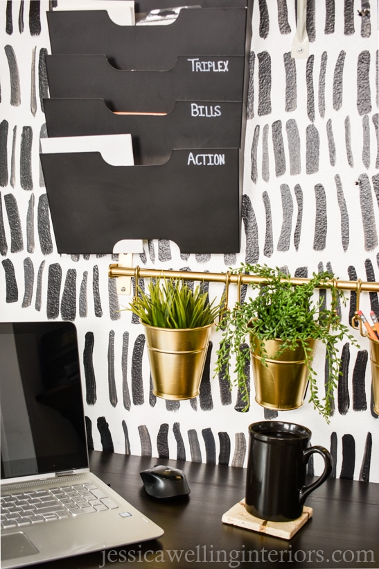 hand painted feature wall behind a desk in a home office