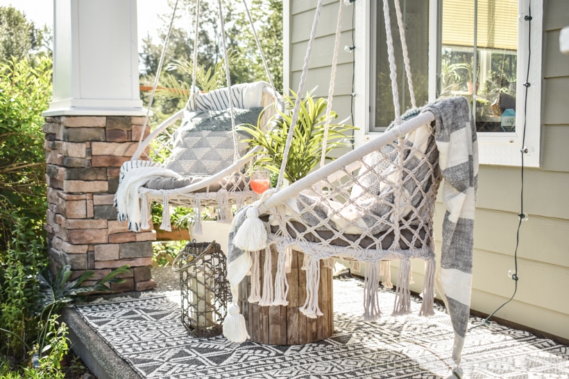 Boho porch swings with a grey outdoor rug