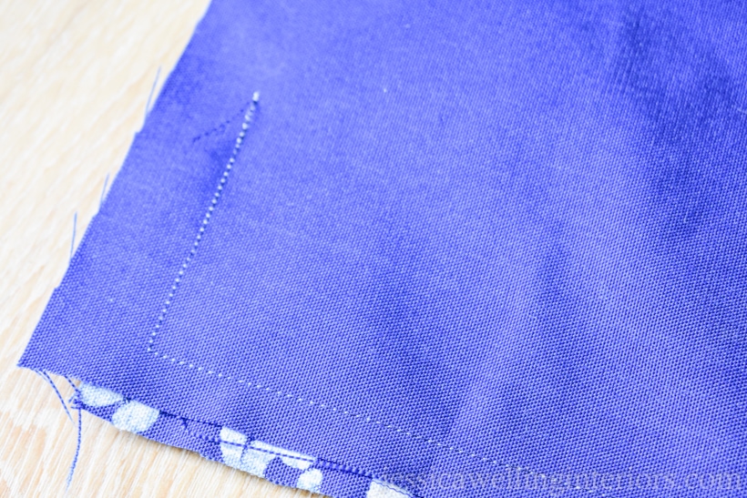 close-up of outdoor pillow case sewed together with white thread