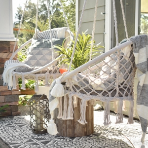 porch swings with a boho outdoor rug