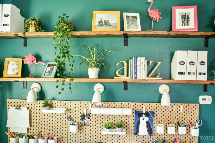 wall above school desk for home with DIY floating shelves and pegboards to hold school supplies
