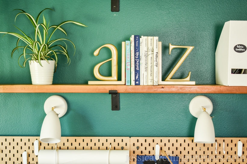 close up of DIY floating shelves mounted above a school desk for home