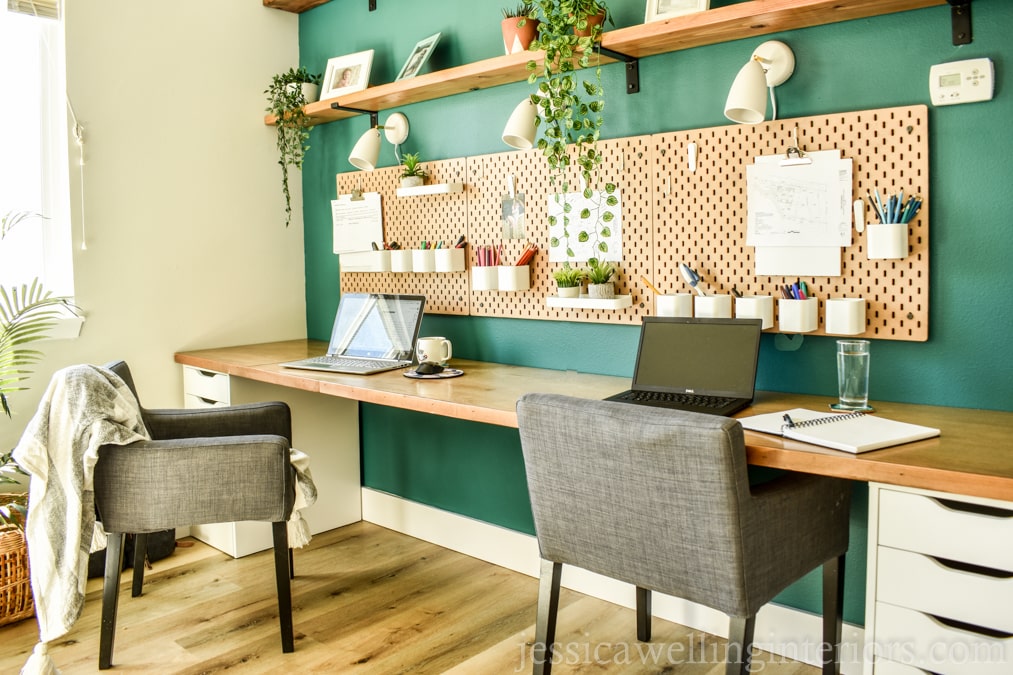 Ikea hacked desk with two workstations, Alex drawer units, and a green accent wall