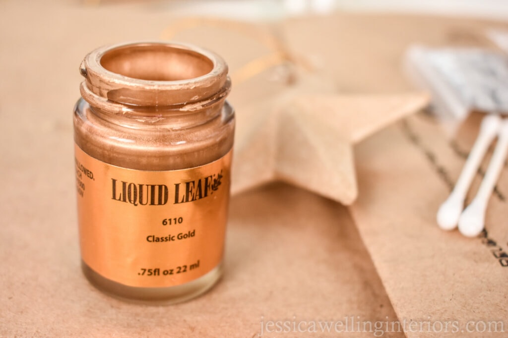 close-up of jar of gold leaf paint