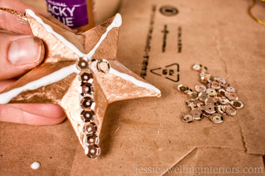 sequins being applied to a handmade Christmas ornament