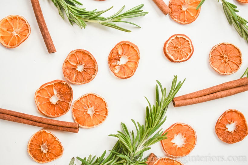 dried orange slices with cinnamon and rosemary sprigs