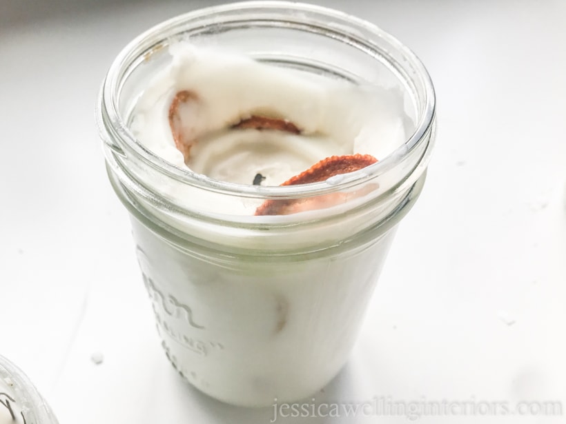 image of a mason jar candle with dried orange slices in it