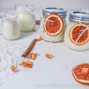 DIY soy candles with dried orange slices tied on for decoration