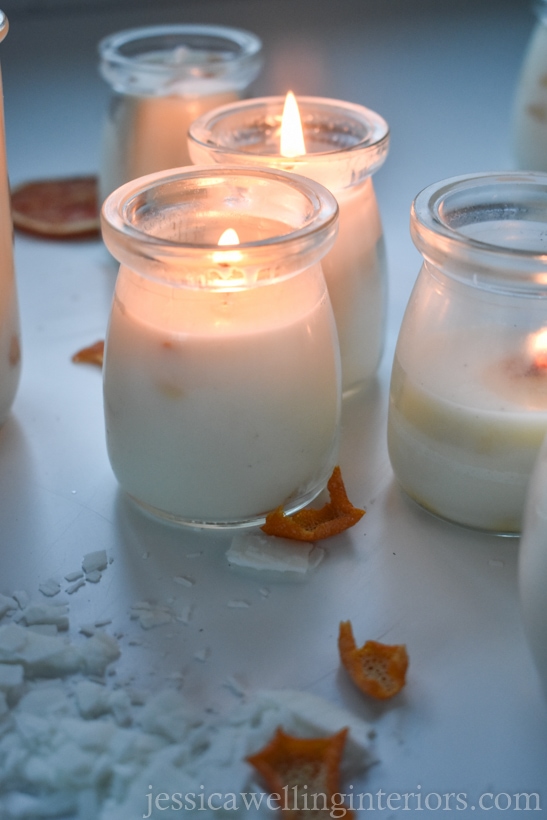 glowing DIY soy candles in glass jars with complete wax pools