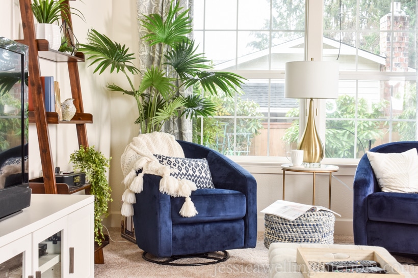 modern Boho living room with two blue barrel accent chairs