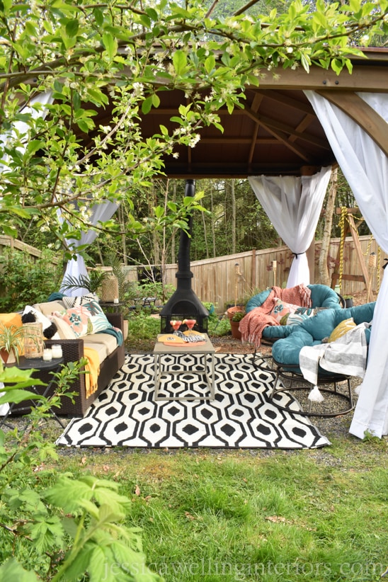 Yardistry gazebo with diy outdoor curtains hanging in the corners