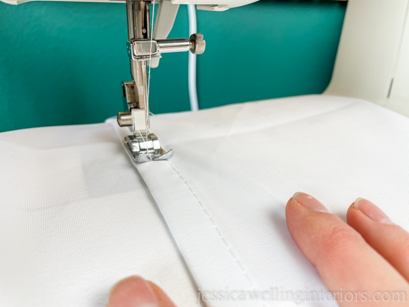 sewing machine sewing seam on an easy outdoor patio curtain panel