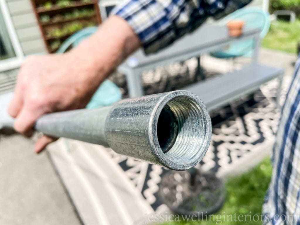 close-up of rigid coupling on the end of a DIY string light pole