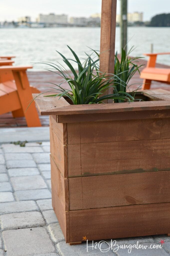 close-up of a DIY planter box string light post