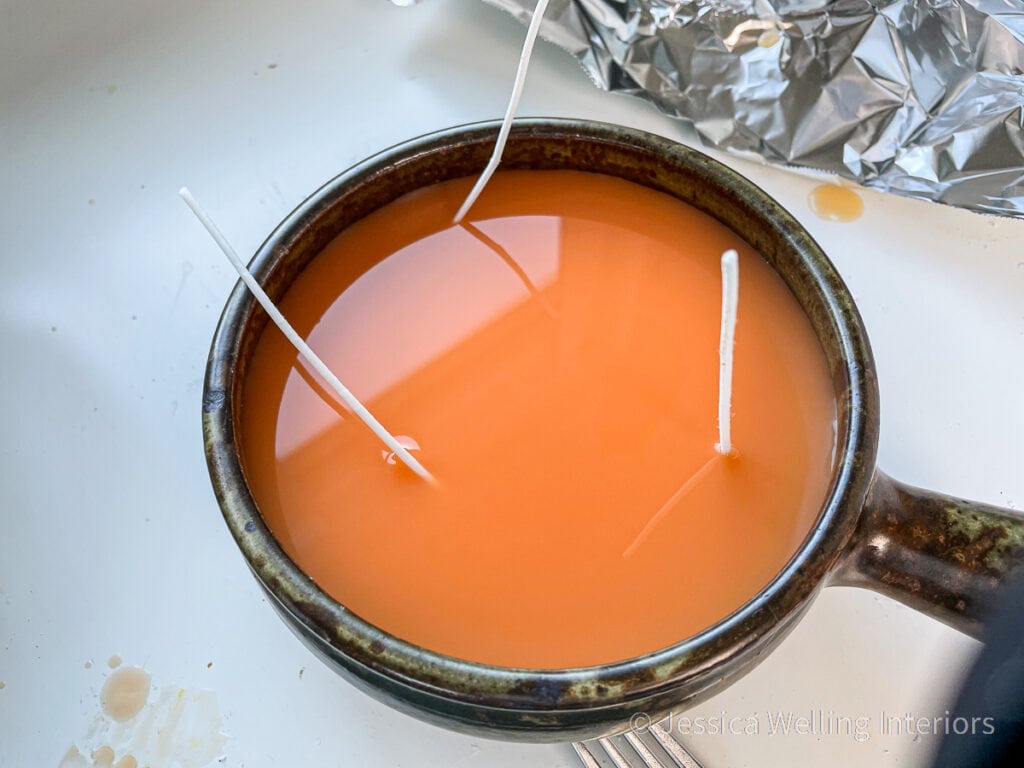 Autumn harvest-scented candle cooling after wax was poured