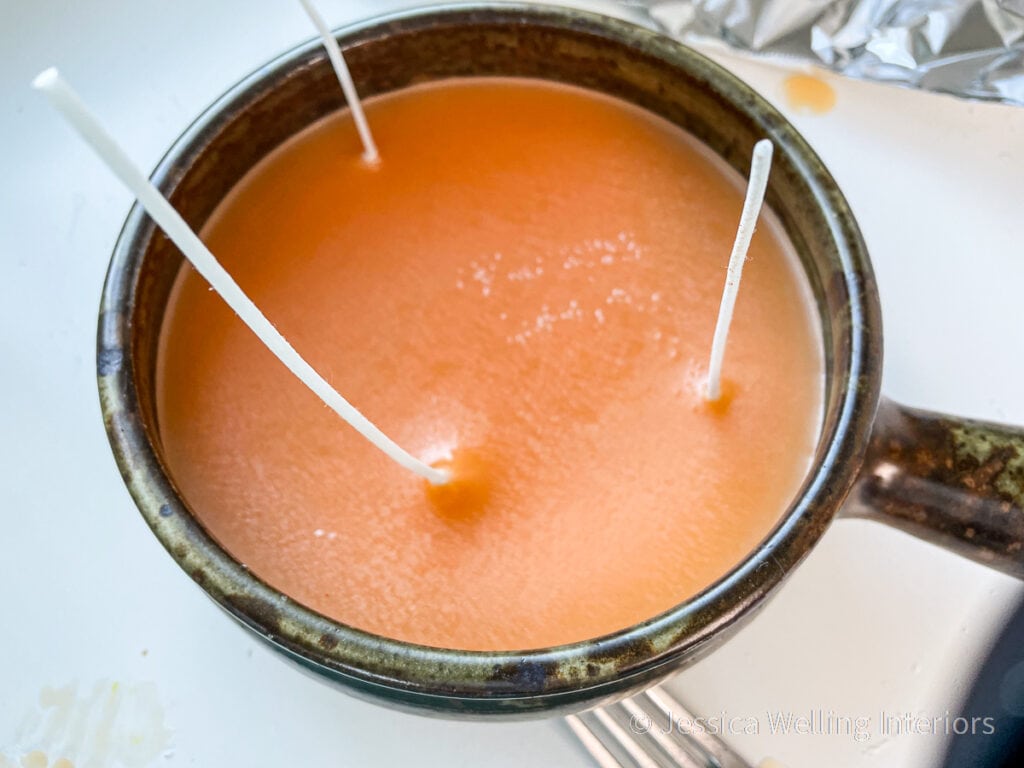 close-up of the top of a large Fall-scented paraffin candle after the first pour