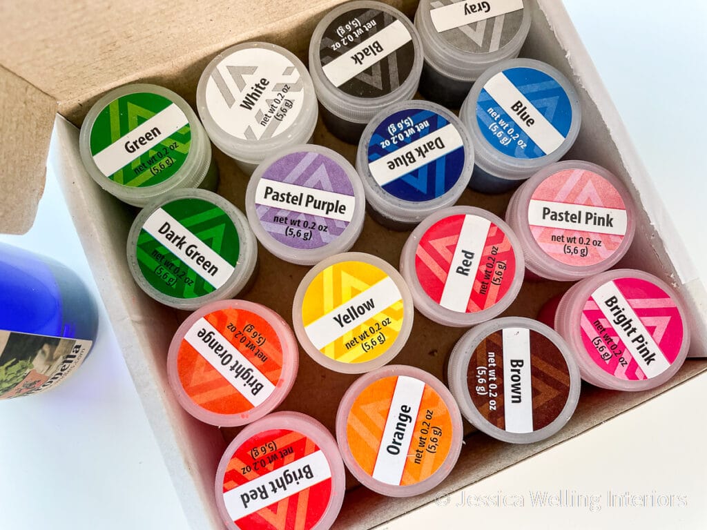 box of containers of wax dye chips in every color for candlemaking
