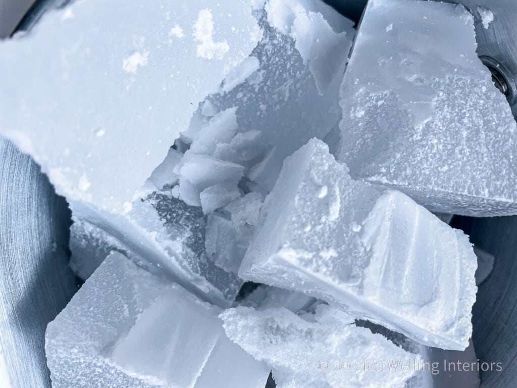 close-up of chunks of paraffin wax in a metal pitcher