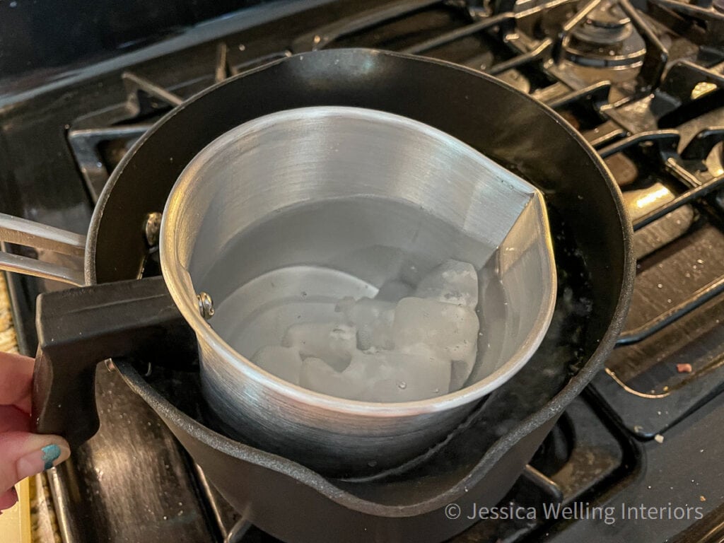 close-up of wax melting in a double-boiler on the stove top