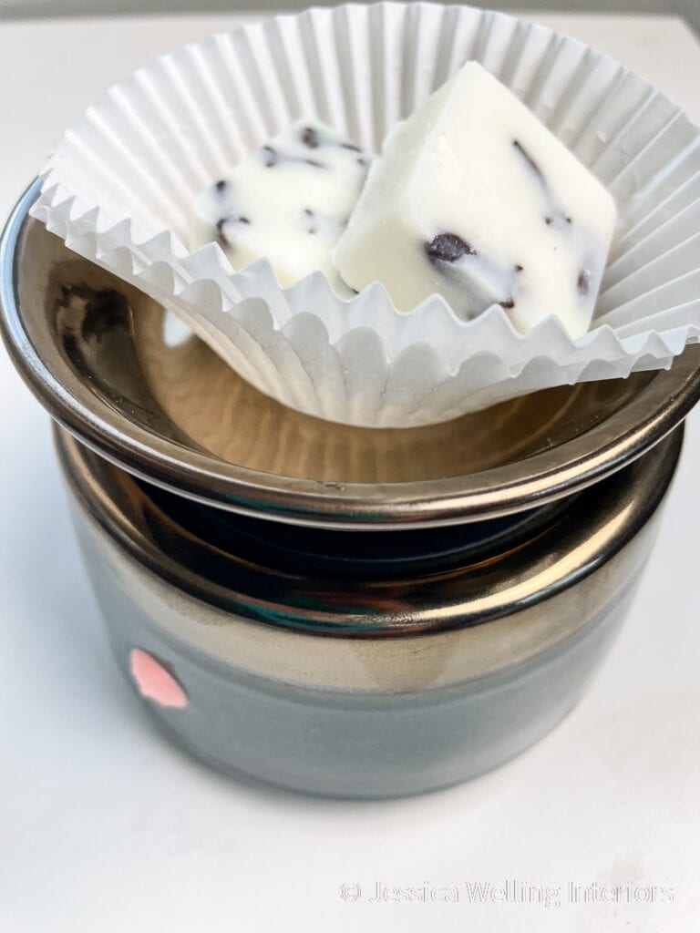 close-up of orange clove wax melts in a wax warmer