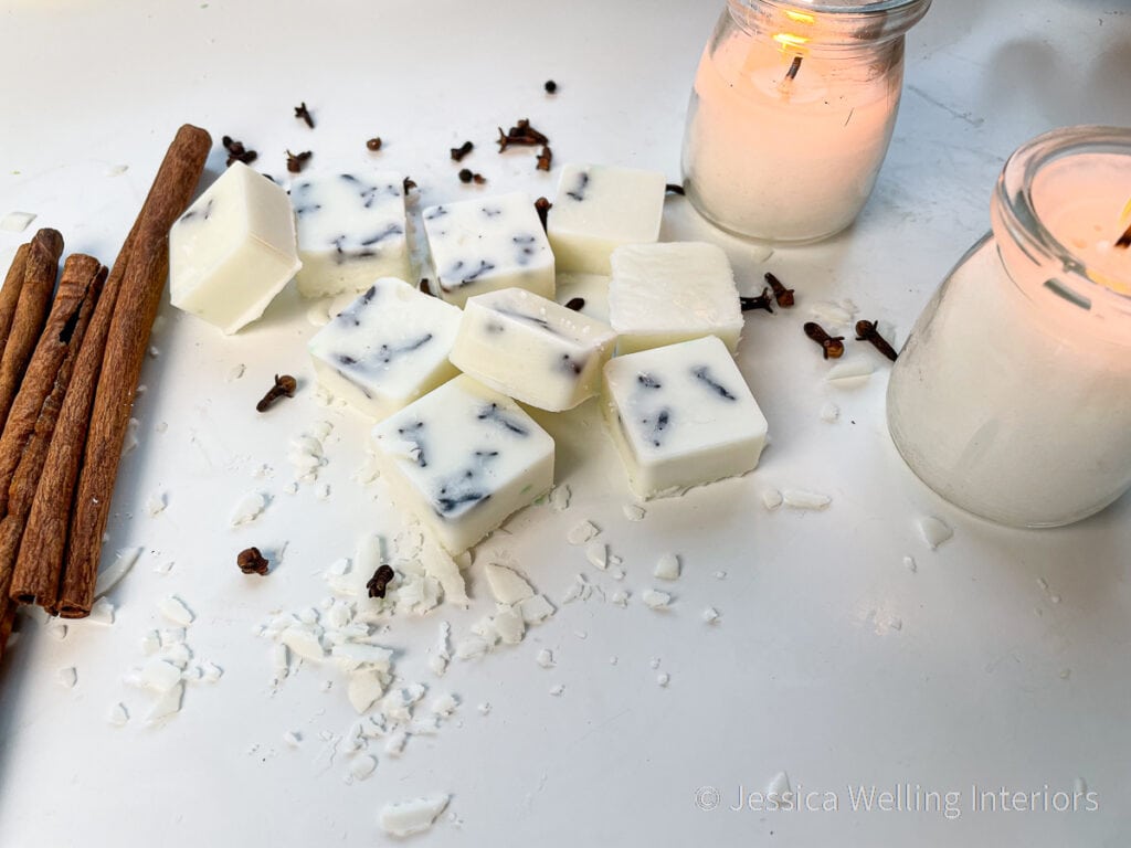 DIY soy wax melts with orange & clove fragrance, cinnamon sticks, and candles