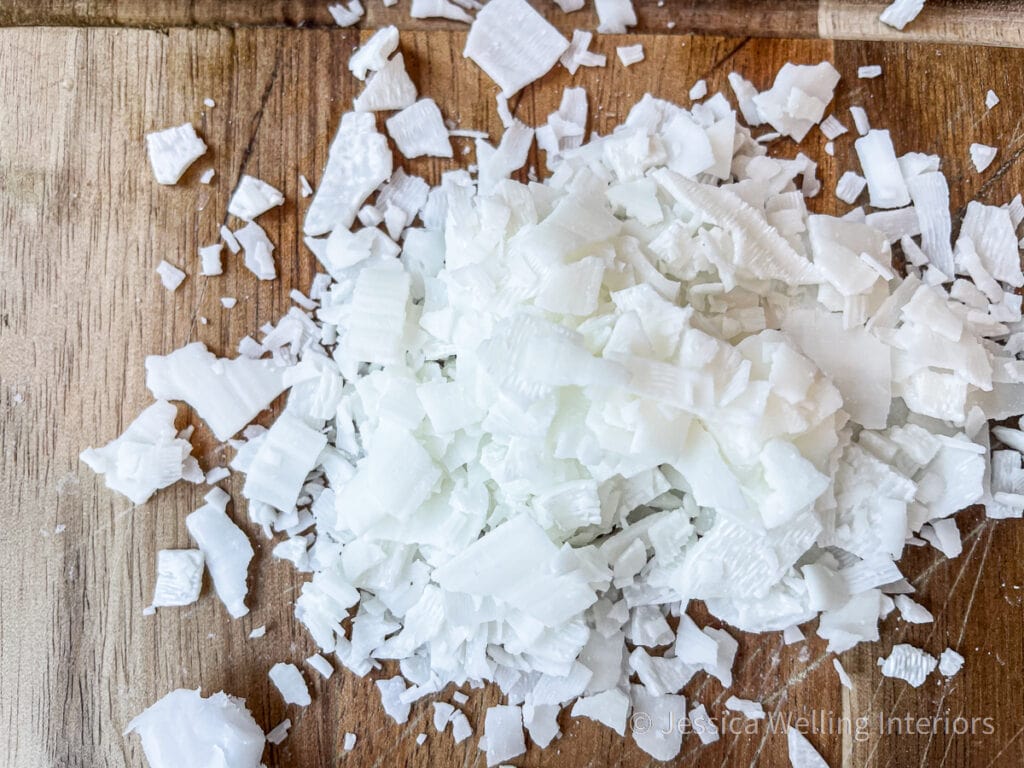 small pile of soy wax flakes on a wood cutting board