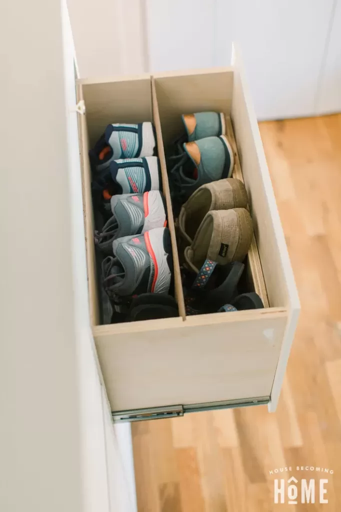 close-up of a drawer holding several pairs of shoes in a DIY shoe storage cabinet