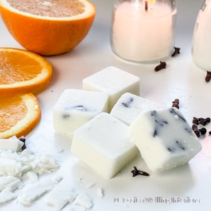 orange clove soy wax melts with orange slices in the background