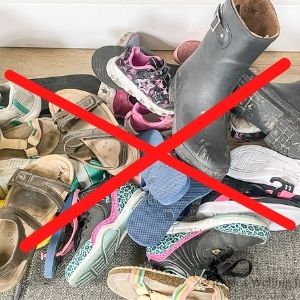 pile of shoes in an entryway