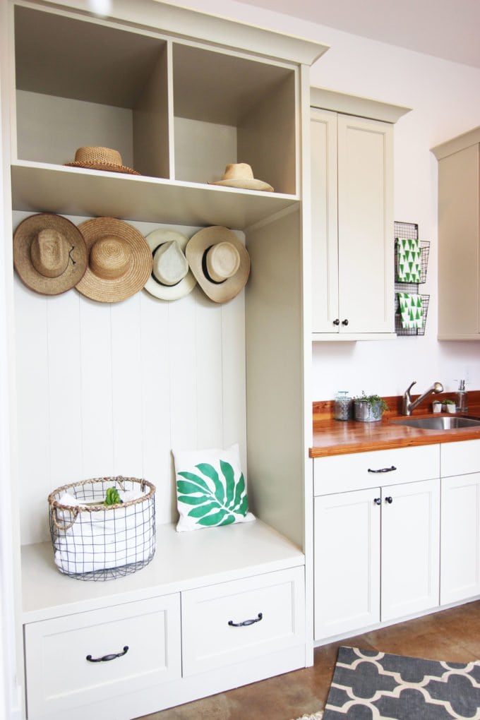 mudroom with built-in hall tree shoe storage bench and coat hooks above it