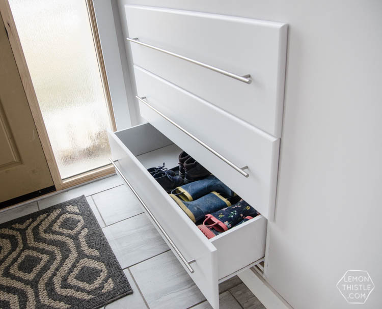 split-level entryway with DIY built-in shoes storage drawers