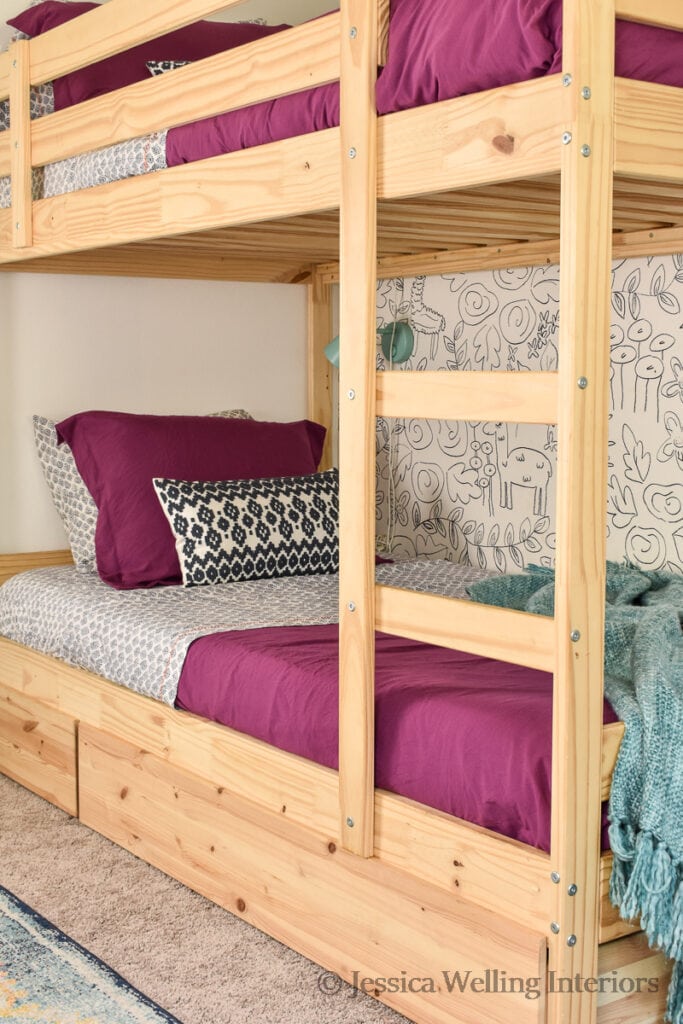 Ikea bunk beds with purple comforters and Boho printed sheets