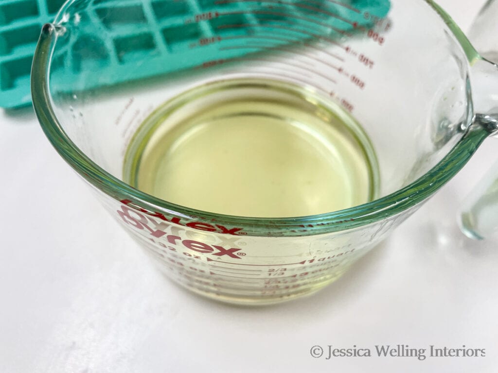 glass measuring cup of melted soy wax