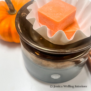 pumpkin spice scented wax melts in a wax warmer cup