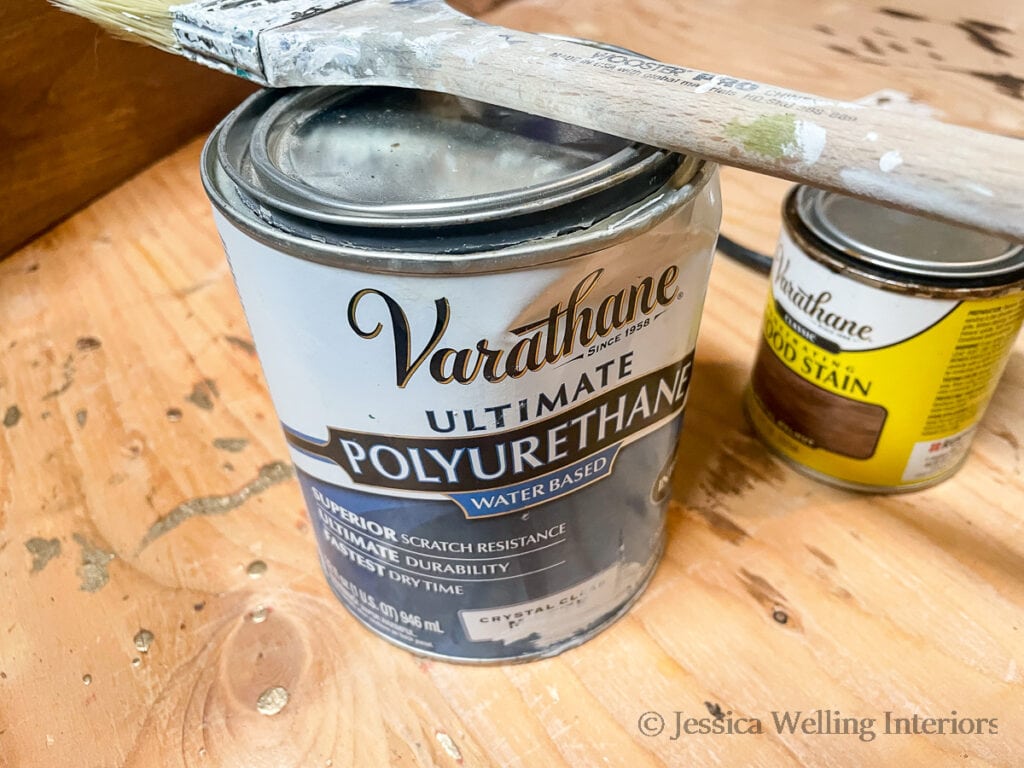 can of matte polyurethane with a paintbrush on top of it