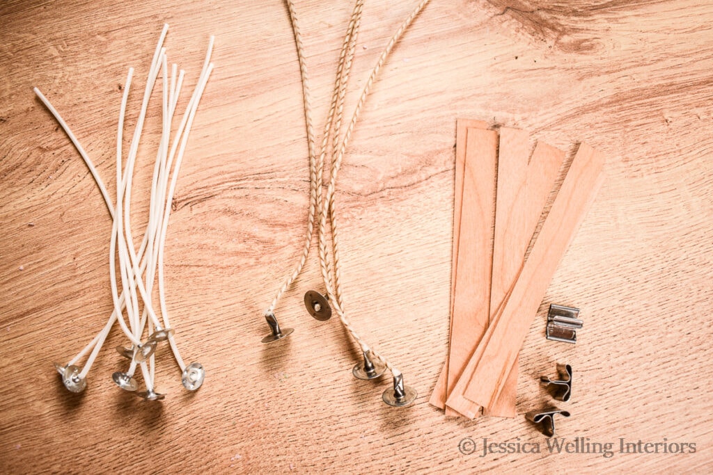 different sizes of candle wicks lined up on a table