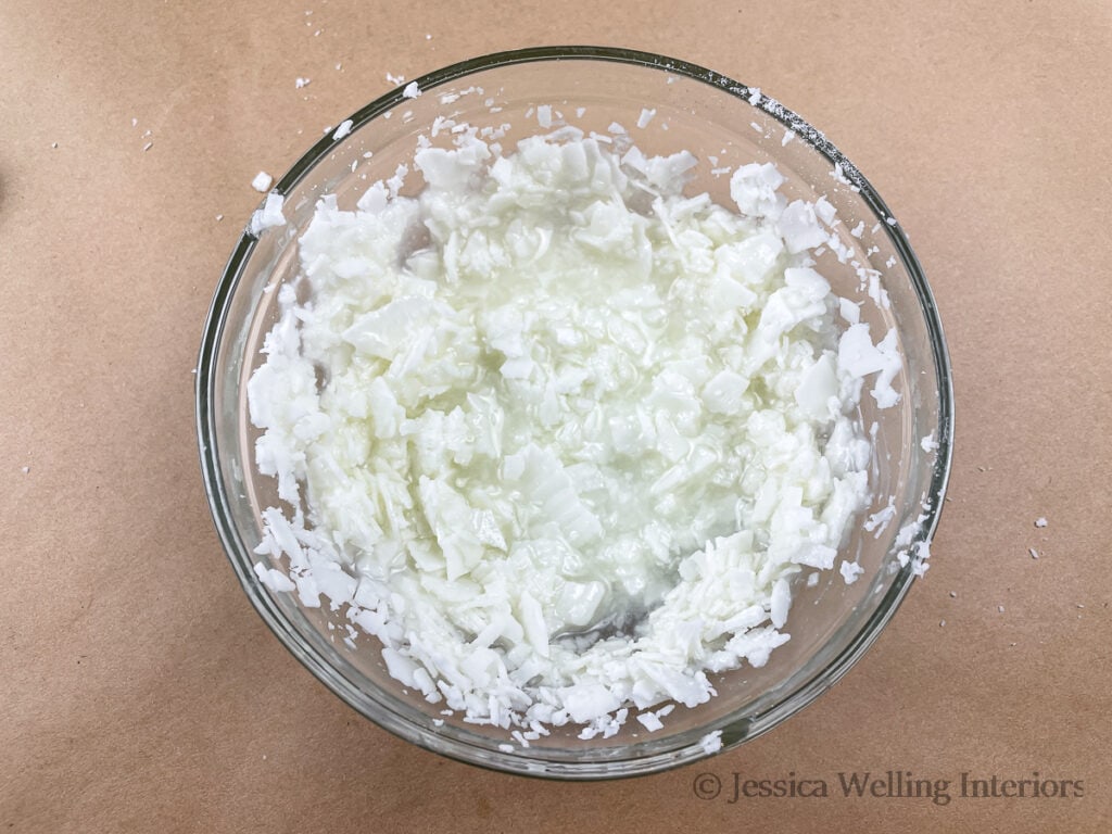 glass bowl of partially melted soy wax flakes