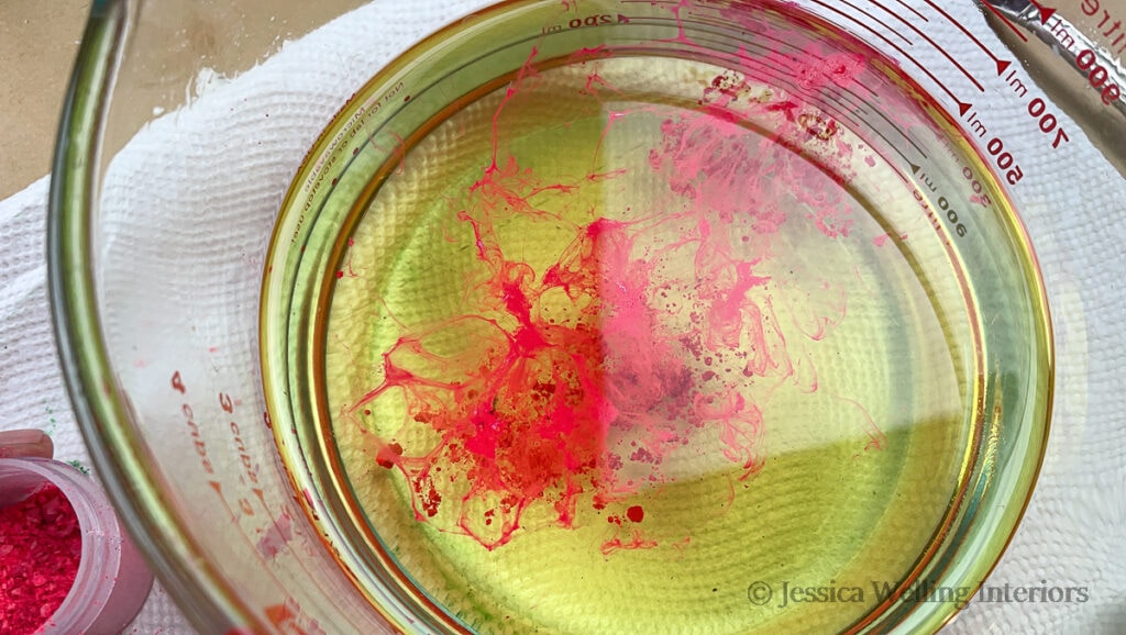 dark pink wax dye melting into a bowl of melted soy wax