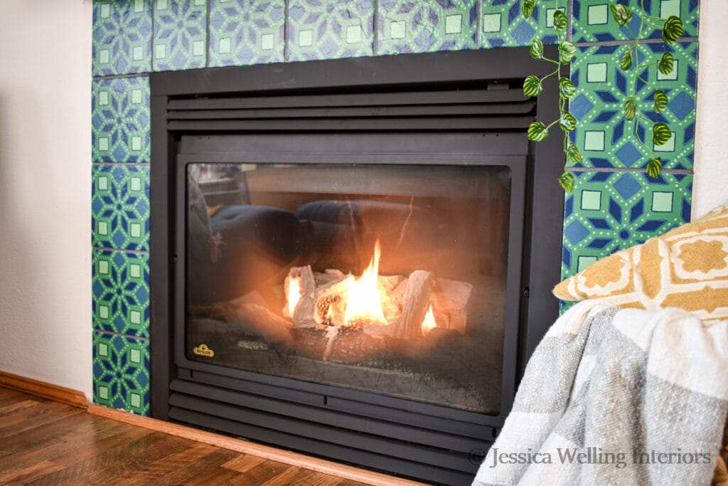 finished fireplace makeover with painted gas insert and painted stenciled tile          