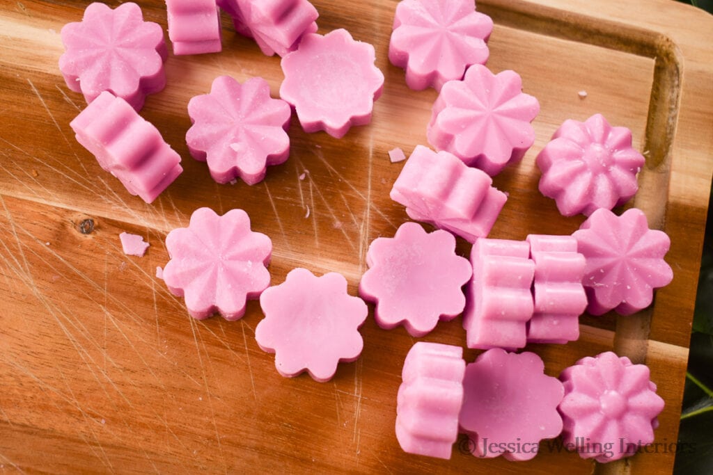 purple flower-shaped wax melts made with Orchid & Black Amber fragrance oil from The Wooden Wick Co.