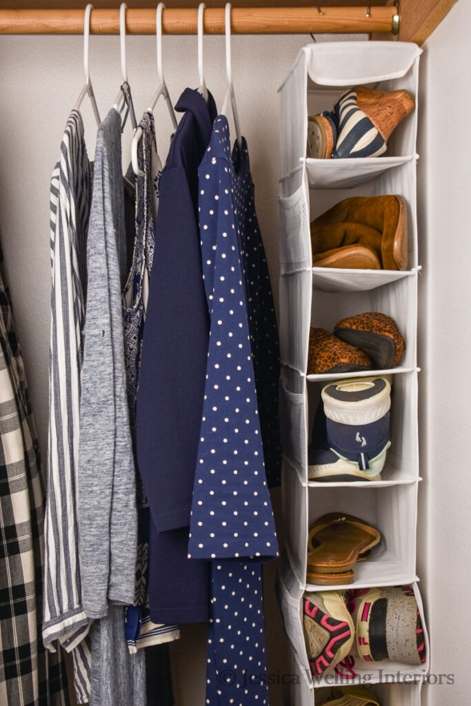 closet with a hanging shoe organizer