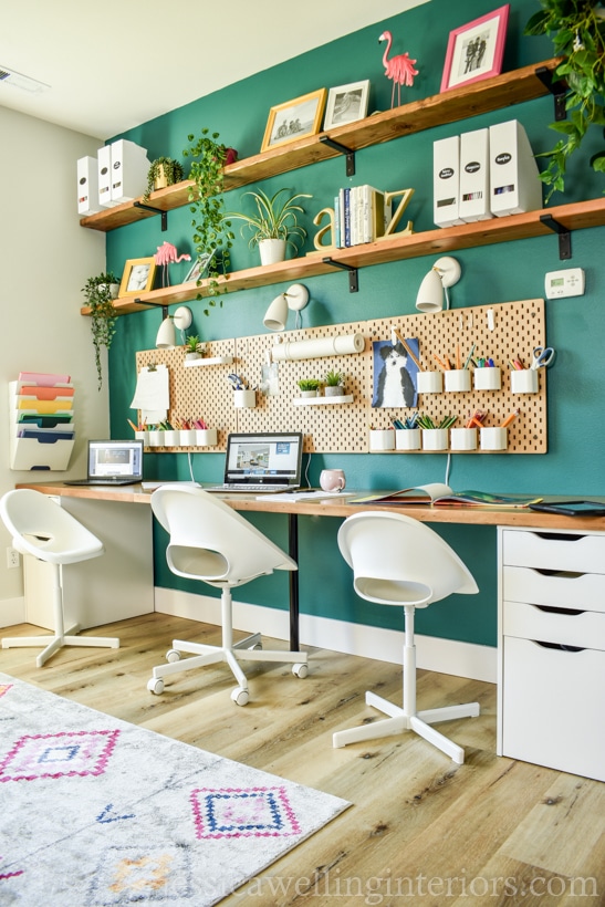 Floating shelves store above desk