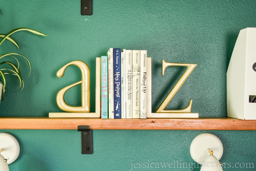 close-up of DIY shelf with books and alphabet bookends