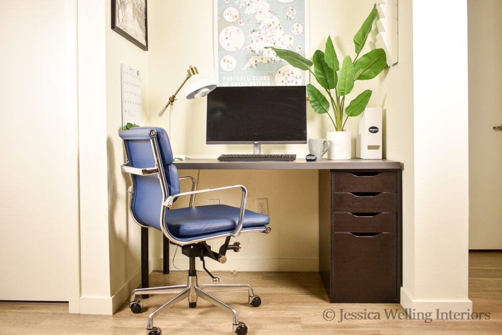 closet office with an Ikea Alex desk and a blue task chair