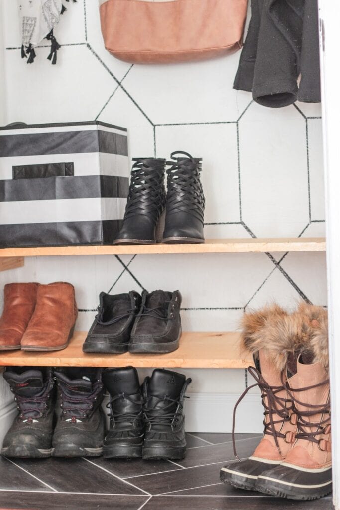 entryway coat closet with DIY shoe storage shelves