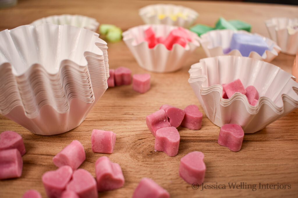 stack of wax melt liners and a variety of different wax melts
