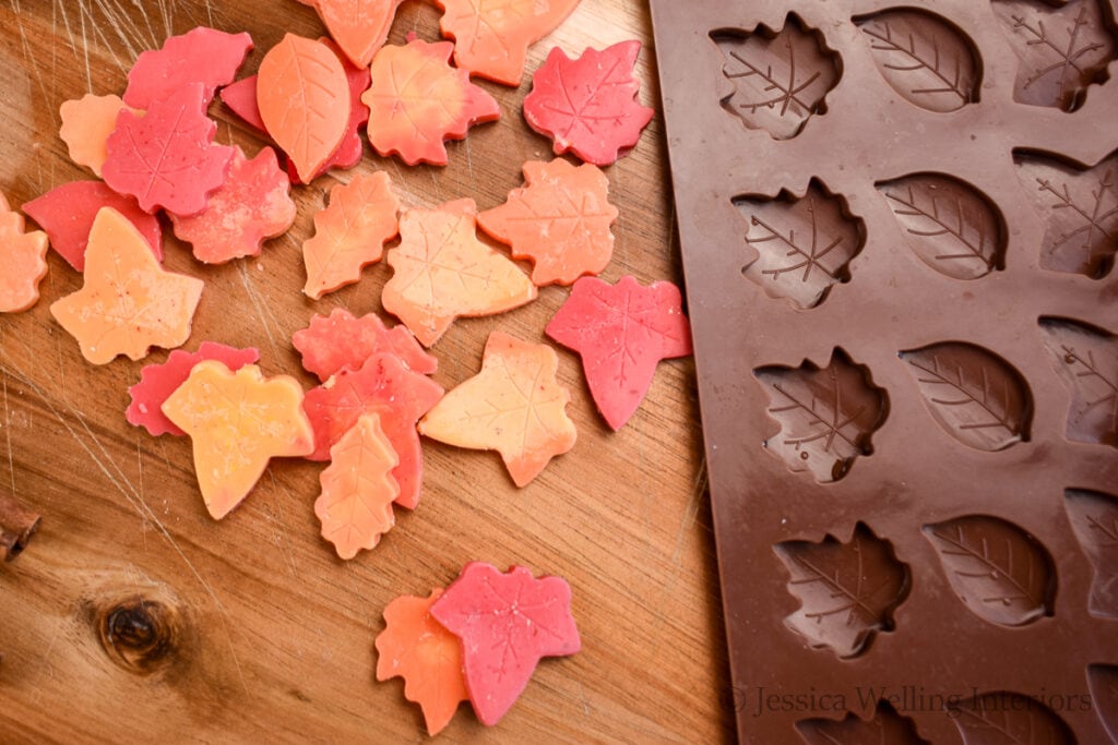 close up of leaf-shaped wax melts and a leaf wax melt mold