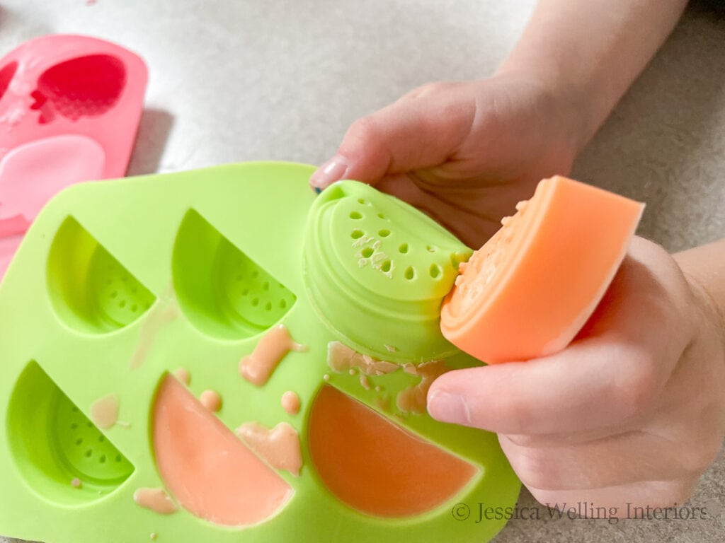 DIY wax melts being removed from a silicone wax melt mold