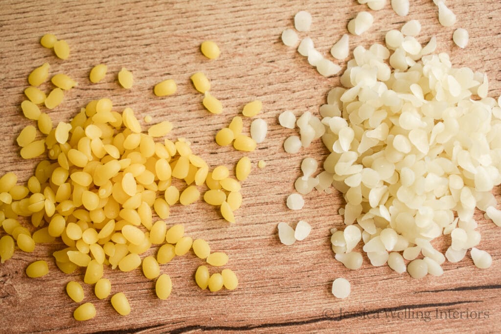 two small piles of beeswax pastilles- yellow beeswax on the left and white beeswax on the right