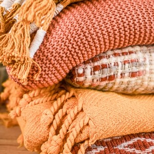 stack of Fall throw blankets with tassels
